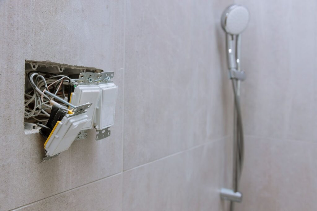 A shower head with a cord attached, ideal for bathroom renovation and remodel, transforming your bathroom.