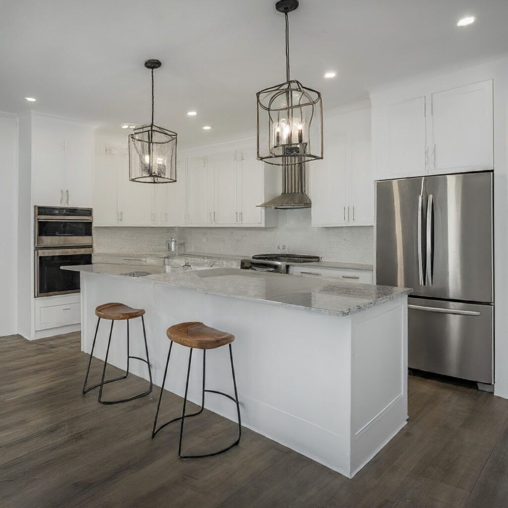 A modern kitchen featuring white cabinets and stainless steel appliances, showcasing a successful renovation project.