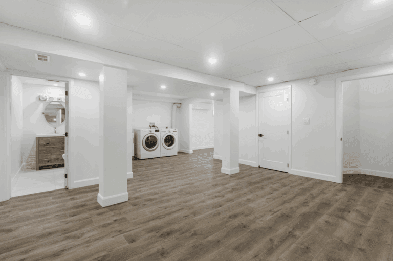 new renovated basement with white walls to showcase basement finishing utah services